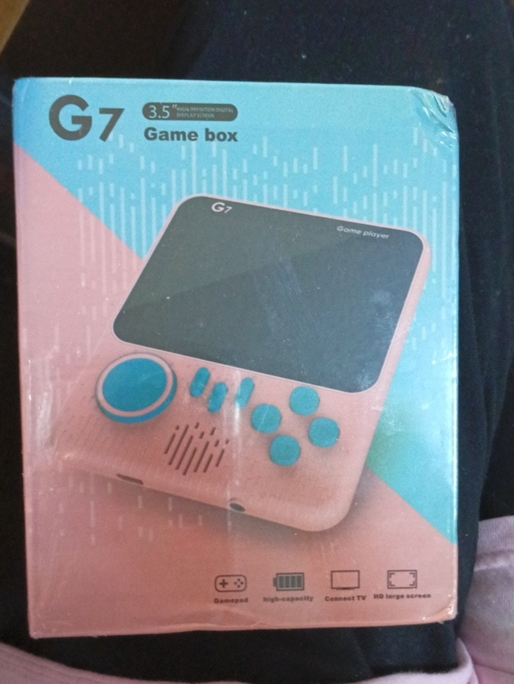 Pink Handheld Game Console with Blue Controls